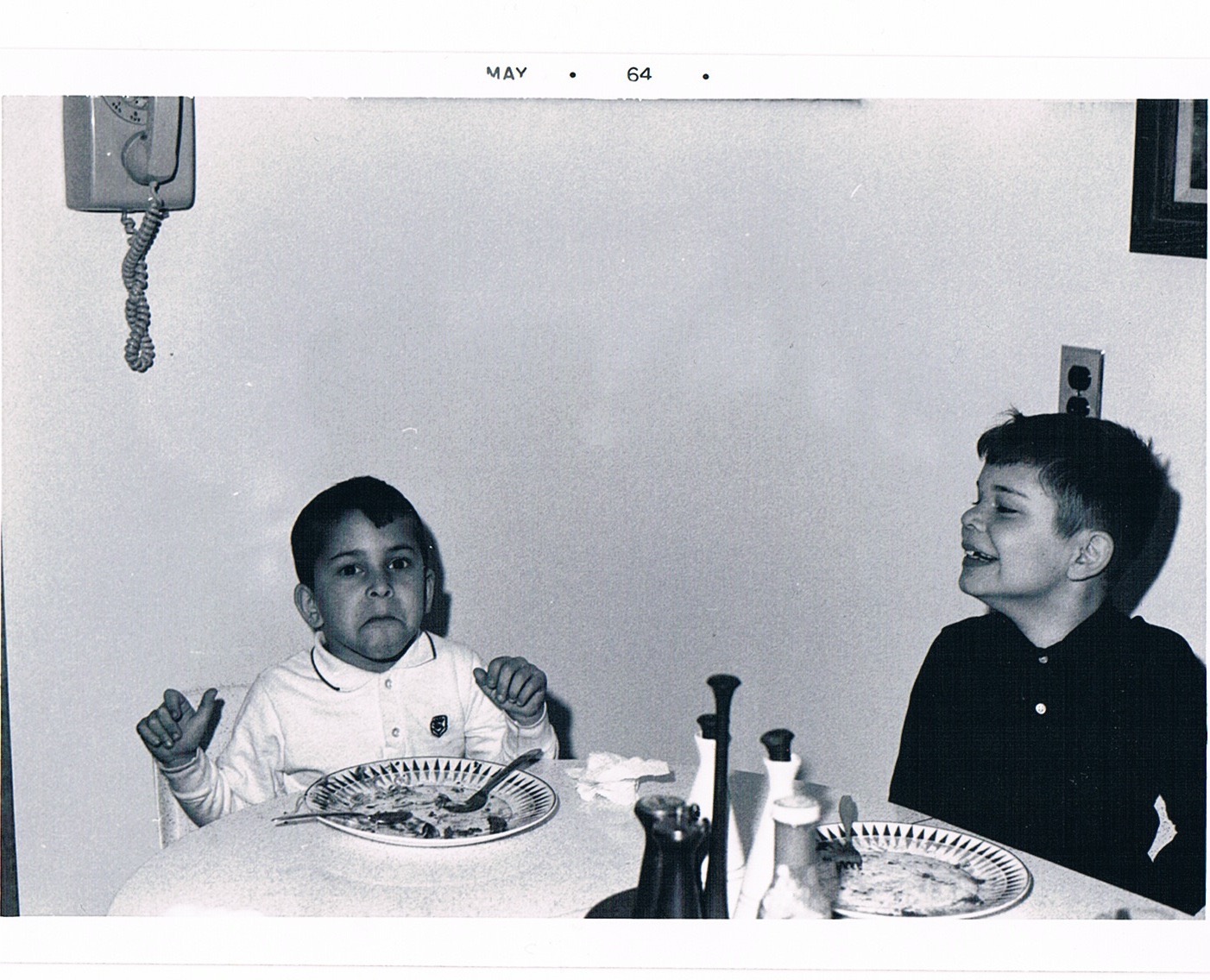 Pete (left) and Jeffrey (right) Zeldman as children, seated at a kitchen table.
